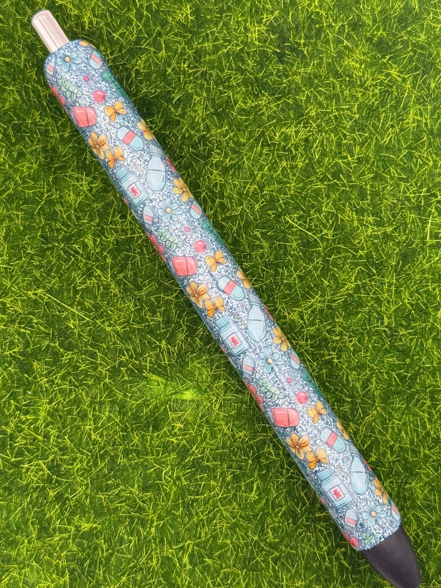 Floral meds on blue glitter-inkjoy pen