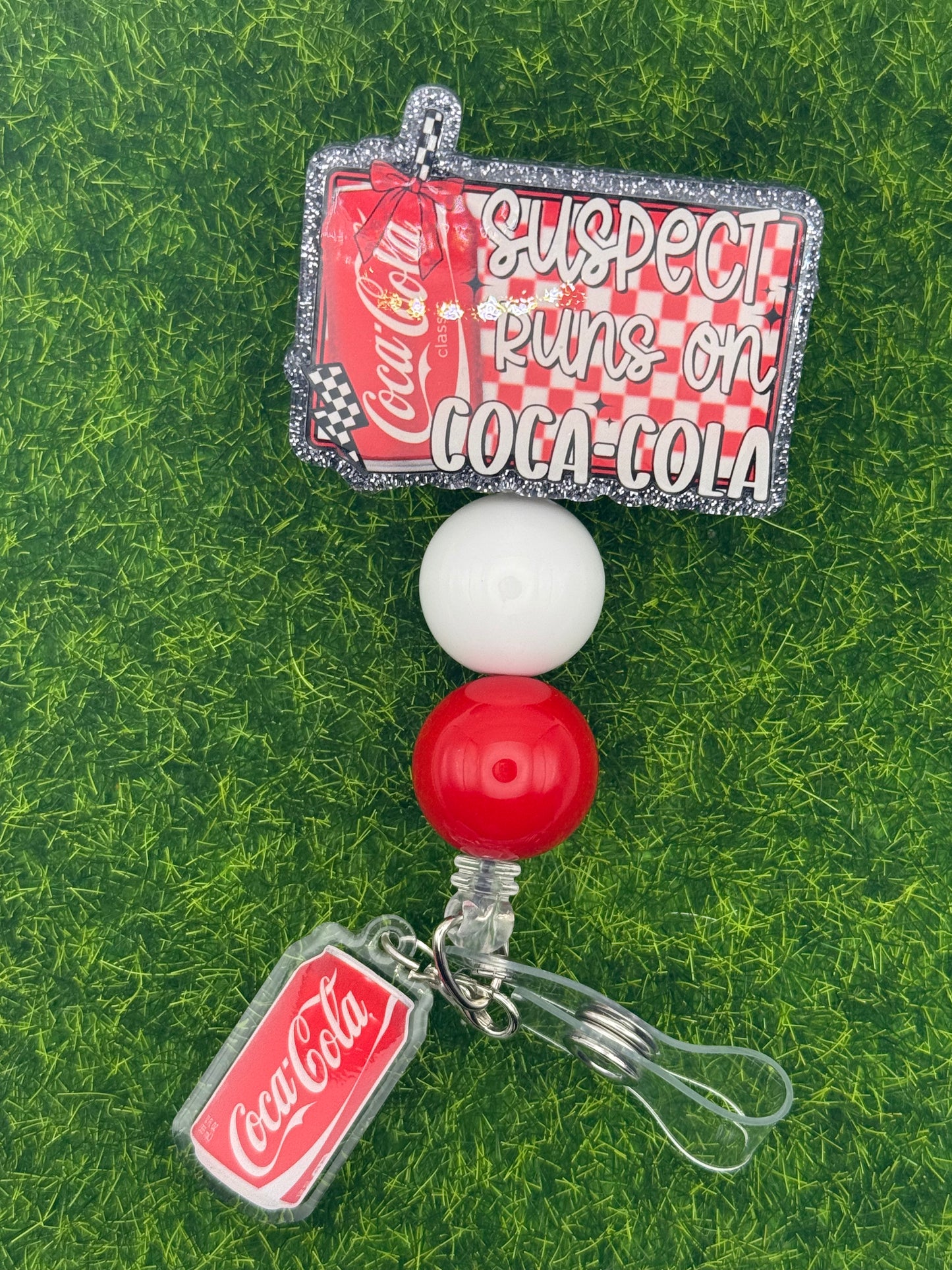Suspect cola-full reel with charm