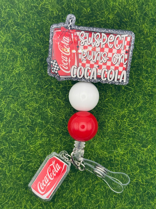 Suspect cola-full reel with charm