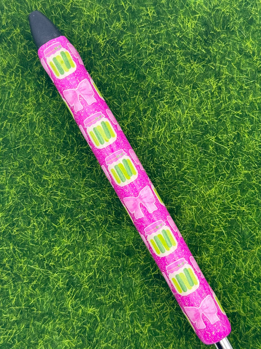 Pickles and bows on pink pen