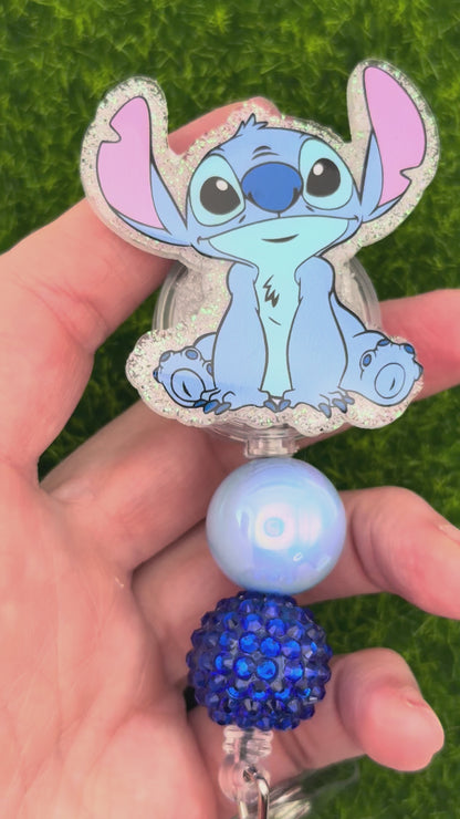 Blue alien sitting